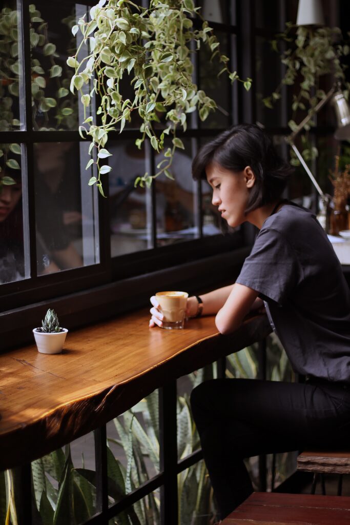 Person enjoying Sumiyaki Coffee, Authentic Japanese Coffee