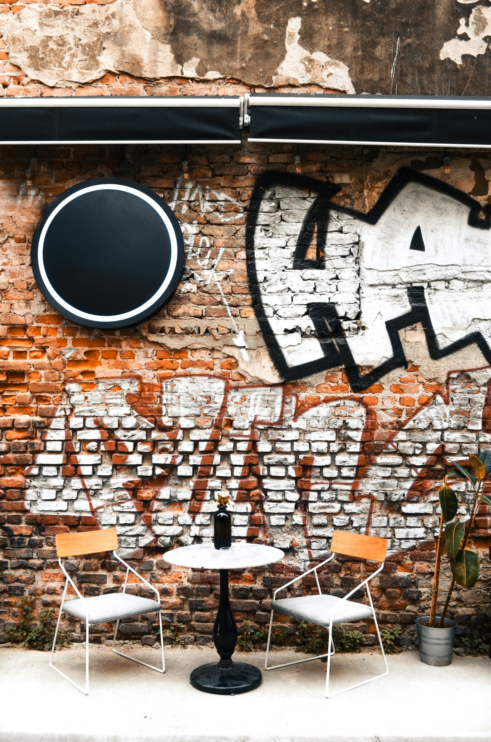 Our cafe is one of the popular cafes in Missisuaga because of these locally crafted grafities on the wall. This picture represents an aesthetic corner of our cafe where people love to seat and drink coffee. 