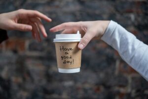 A simple coffee cup message like 'Have a good day' can brighten someone's morning and foster positive connections.