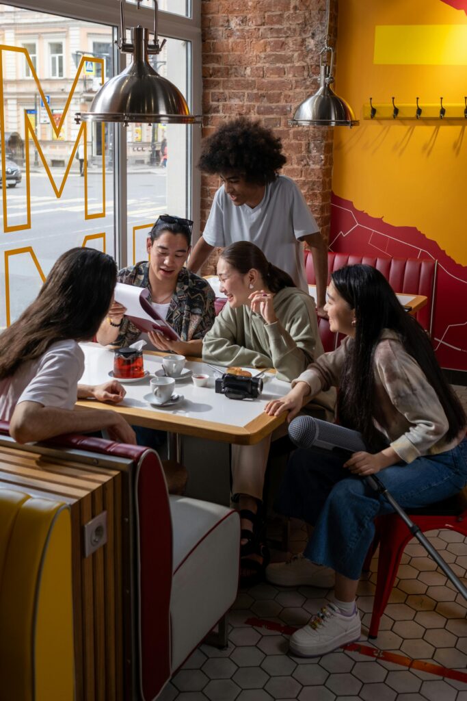 Diverse students enjoying student discounts on coffee while studying together at PSB Cafe in Mississauga, highlighting the community aspect and study-friendly environment.