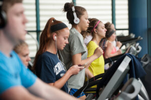 Students doing a beginner friendly fitness class on campus.